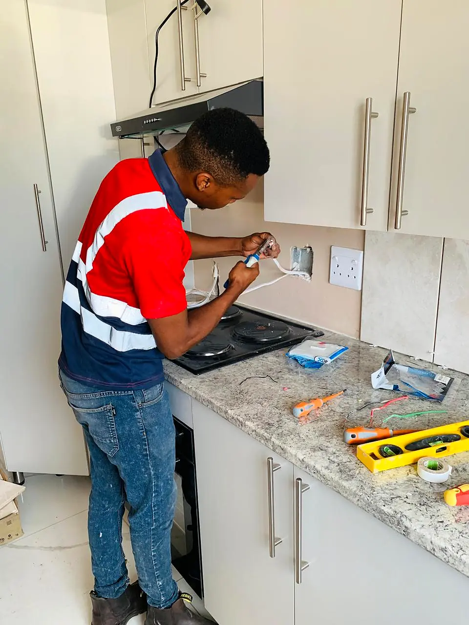 Electrician installing a residential wall socket
